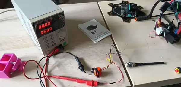 In the UAV lab, checking the telemetry antena.